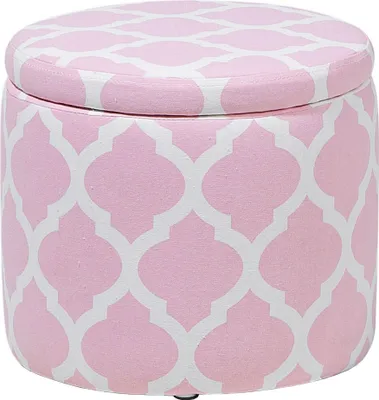 A round, pink ottoman with a white quatrefoil pattern, shown from a slightly elevated side view against a white background.