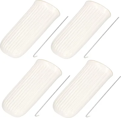 Four ceramic water evaporators for radiators and their accompanying metal hooks are arranged diagonally on a white background.