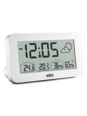 A white digital alarm clock with a weather station display is shown against a white background.