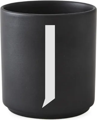 A black cylindrical container with a white vertical stripe on the front.