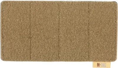 A flat lay image of a tan patch panel.