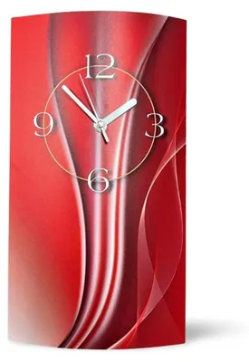 A modern wall clock with a red abstract design.