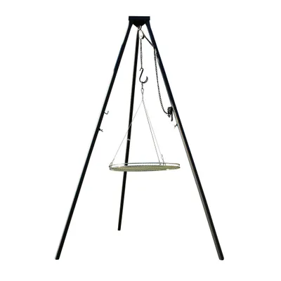 A black metal tripod grill stand with a circular grill grate suspended by chains.