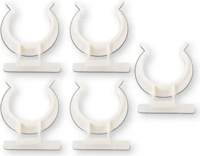 A set of five white plastic clips arranged on a white background.