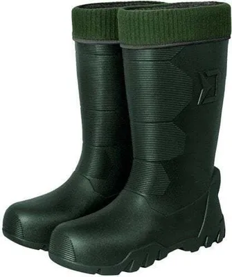 A pair of green rubber boots with green knitted cuffs.
