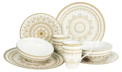 A collection of white and gold mandala-patterned dinnerware, including plates, bowls, and mugs, arranged on a white background.