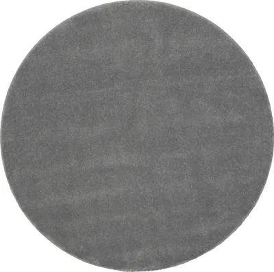 A circular gray rug.