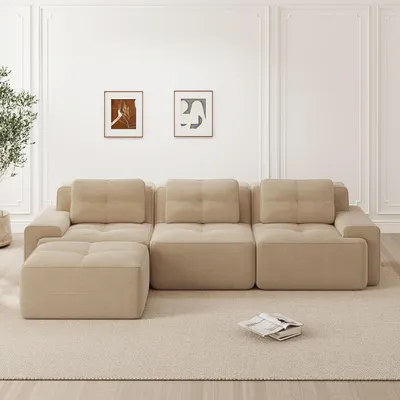 A modular L-shaped sofa with an ottoman in a living room setting.