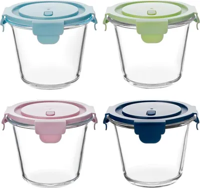 Four glass food storage containers with colored lids are arranged in a two-by-two grid against a white background.