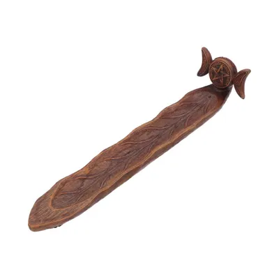 Dieses Räucherstäbchenhalter hat eine organische, astähnliche Form, die an einen Baumstamm erinnert.