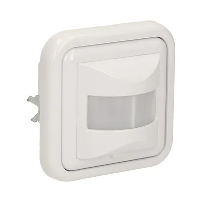A white motion sensor with a grey sensor lens, mounted on a white wall plate.