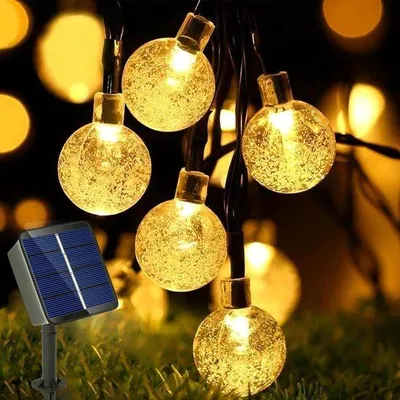 Immagine prodotto di Ghirlanda luminosa a energia solare da esterno, 5 m, 20 LED, 8 modalità, sfere di cristallo. Ghirlanda luminosa a energia solare da esterno, 5 m, 20 LED, 8 modalità, sfere di cristallo, ideale per giardino, terrazza, balcone e matrimoni
