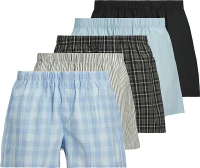 A stack of men's boxer shorts in various patterns and colors.