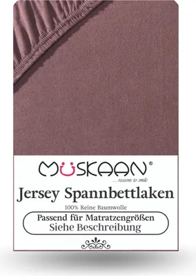 A close-up of a brown jersey fitted sheet with text overlay.