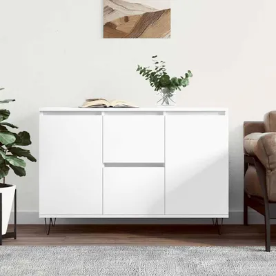 A white sideboard is shown in a room with a plant and a book on top.
