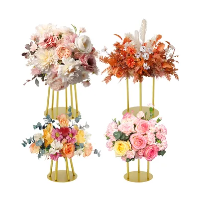 Four floral arrangements on gold stands against a white background.