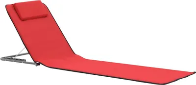 A red foldable beach mat with a headrest on a white background.