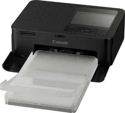 A black Canon SELPHY CP1500 mobile photo printer with its paper tray extended.