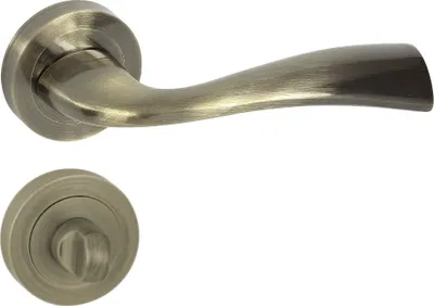 Produktbild von DOMINO Türgriff Drückergarnitur WC - Badezimmer Set | Rund-Rosette | Türbeschlag für Badezimmertüren | Set WC - Rosetten-Garnitur | Türklinke aus Aluminium | Bronze Türdrückergarnitur | FLY-R ECO M3