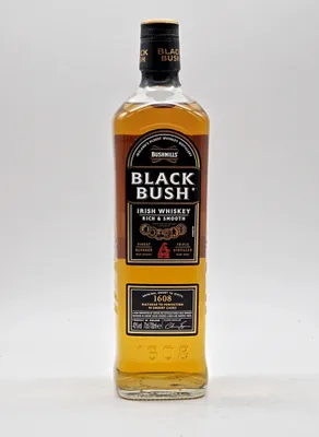 A bottle of Bushmills Black Bush Irish Whiskey against a white background.