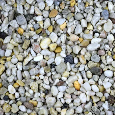 A close-up, overhead view of a pile of small, multi-colored pebbles.