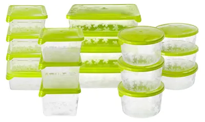 A collection of clear plastic food storage containers with green lids, arranged in groups.
