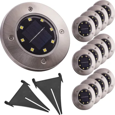 A set of solar-powered ground lights and their mounting stakes.