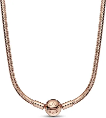 A rose gold colored necklace with a spherical charm in the center.