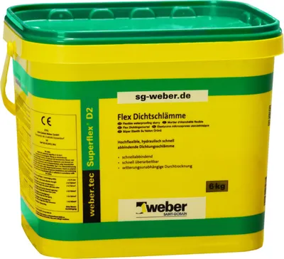 A yellow and green plastic bucket of waterproofing slurry.
