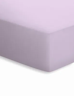 A close-up view of a lavender fitted sheet, showing its texture and corner.