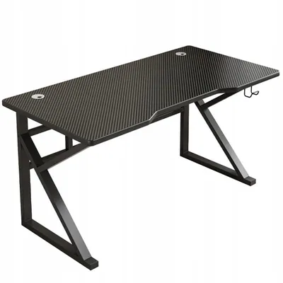 A black gaming desk with a carbon fiber pattern on a white background.