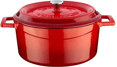 A red enameled cast iron pot with a lid.