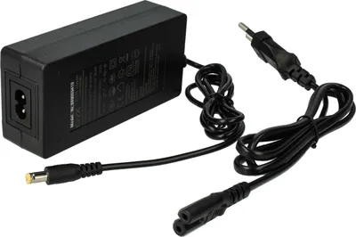 A black power adapter with two cables, one with a European plug and the other with a connector for a device.
