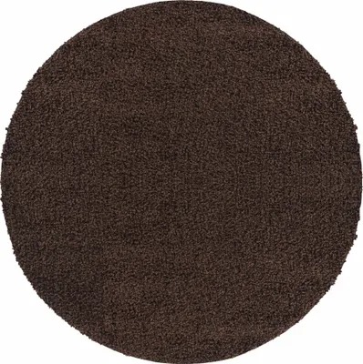 A round, brown shaggy rug.