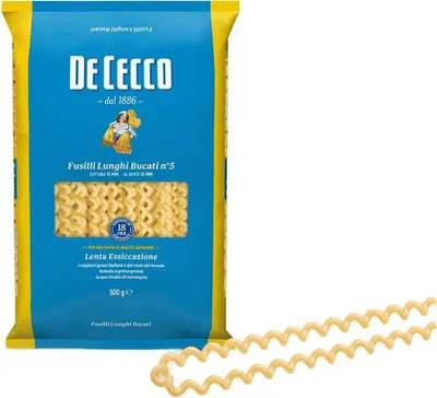A bag of De Cecco pasta is shown, with some pasta strands laid out in front of it.