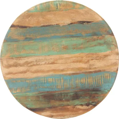 A close-up view of a round tabletop made of reclaimed wood with various colored planks.