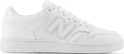 A white New Balance sneaker shown from the side.