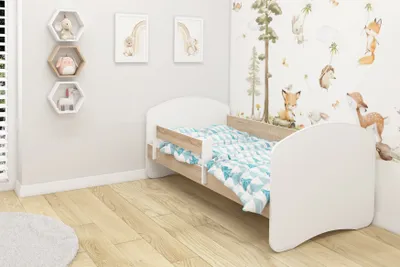 A child's bedroom with a bed and decorative elements.