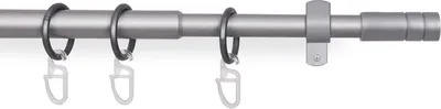 A close-up of a telescopic curtain rod with rings and clips.