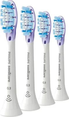 Four Philips Sonicare G3 toothbrush heads arranged diagonally.