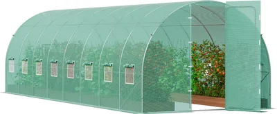 A long, arched greenhouse tunnel with a green PE cover, showing plants inside and an open door.