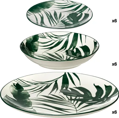 Three plates with a palm leaf pattern are stacked on a white background.