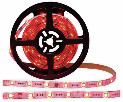 A reel of red LED strip lights with some of the strip unrolled.