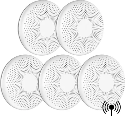 A set of five white, circular smoke and carbon monoxide detectors arranged in a cluster on a white background.