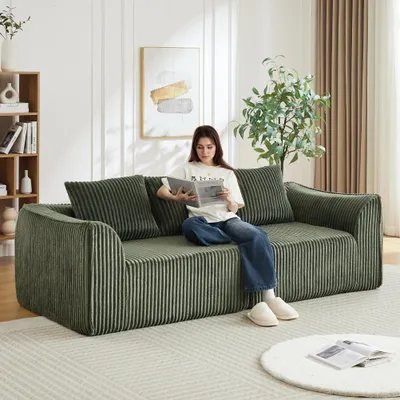 Image de Canapé en velours côtelé aux lignes courbes, 235 cm, dossier en pente douce, 2 coussins inclus, vert