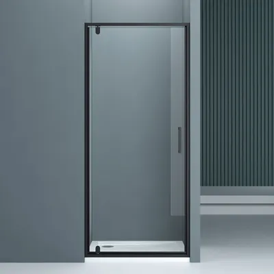 A modern bathroom setting featuring a black-framed shower enclosure with clear glass.
