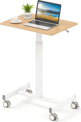 A mobile standing desk with a laptop, a plant, and a cup of coffee on its surface, set against a white background.
