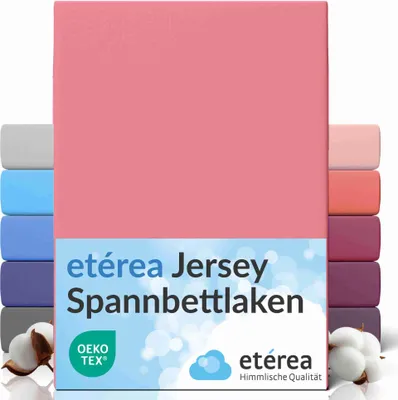 A stack of colorful fitted sheets with a pink one prominently displayed in the front.