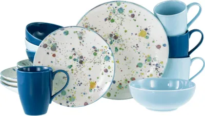 A collection of ceramic dishes and mugs with a speckled design.