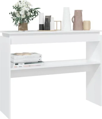 A white console table with two shelves, decorated with a vase of flowers and some decorative items on the top shelf, and books on the bottom shelf.